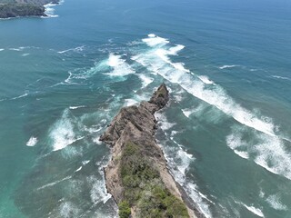 Dramatic ocean waves around Samara's peninsula point.