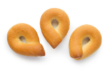 Butter pretzels on a white background. Three bagel cookies.