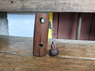 Traditional wooden cowbell (ranti) from Indonesia, handcrafted from hardwood to produce a...