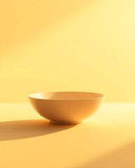 Minimalist Bowl on Golden Surface with Soft Light and Shadow Play