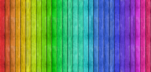 Rainbow wooden planks – a colorful seamless wood background texture. Timber panoramic pattern wall banner.