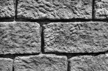 Beautiful stone wall background in black and white close up view