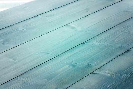 Fototapeta Flat design illustration is showing horizontal teal wood planks with grain texture and knots
