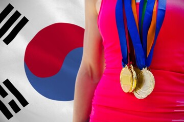 Midsection of medalist against South Korean flag