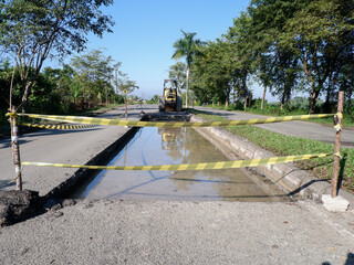 barrier tape or barricade to prevent crossing damaged roads