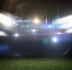 Flat design graphic is showing stadium floodlights casting beams and lens flares over grass field