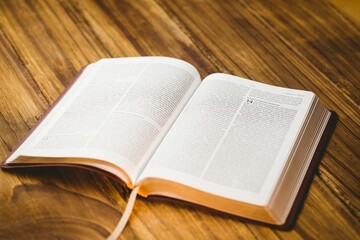 Close-up of bible on wooden floor