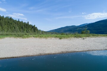 Naklejka premium Lake Against Mountain Range
