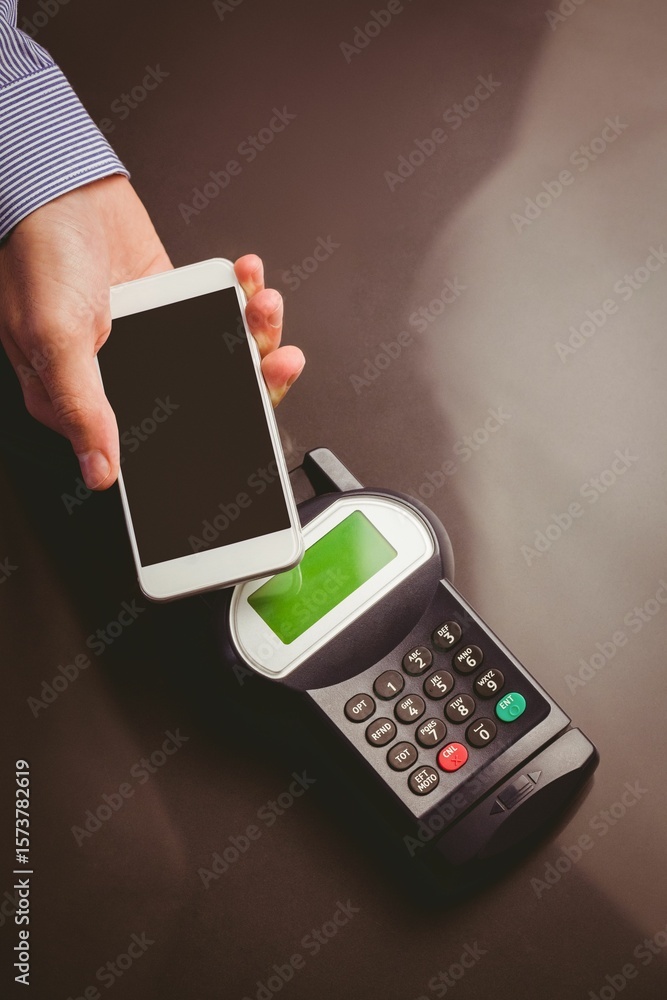 Poster man using smartphone to express pay