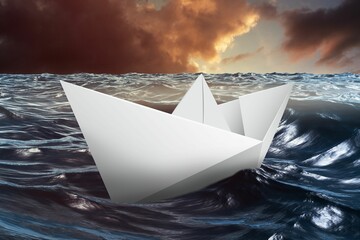 Paper boat floating on the sea