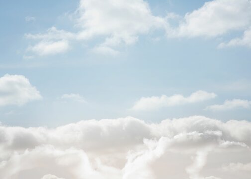 Fototapeta Panoramic flat design featuring fluffy cumulus and wispy clouds drifting under pale blue sky