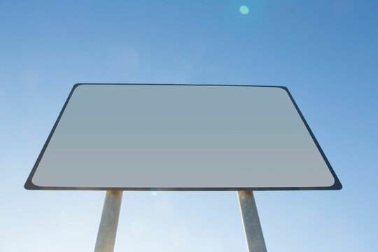 Fototapeta Low angle view of blank billboard