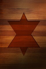 Recessed six-pointed star carving is showing on wooden plank surface in flat style, with shadowing