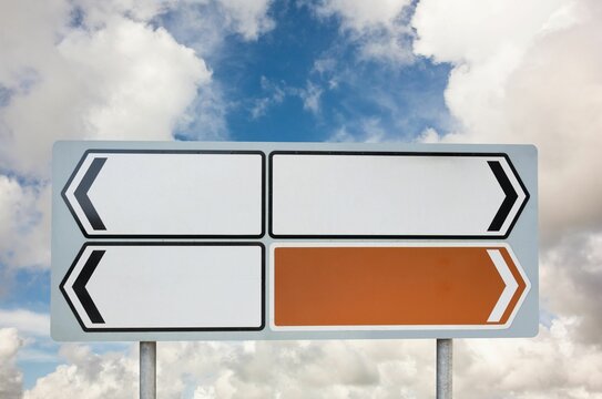 Fototapeta Blank sign posts against cloudy sky