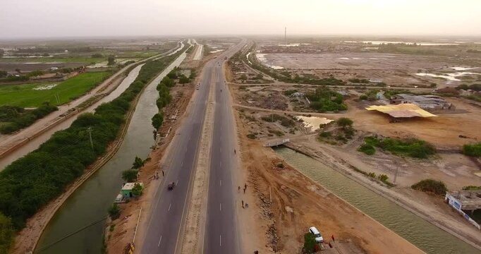 Aerial view of highway and bridge over canal, Pakistan.