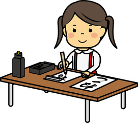 お習字をする女の子