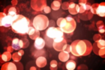 Glowing red-orange bokeh circles are floating in flat design over dark backdrop with light specks