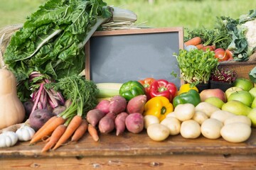 Various vegetables with slate chalk board