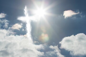 Flat design illustration is showing cross-shaped cloud formation lit by sun rays with lens flare © vectorfusionart