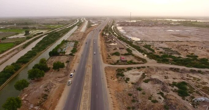 Aerial view of highway and canal in desert, Pakistan.