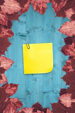 Fototapeta Autumn leaves with yellow note