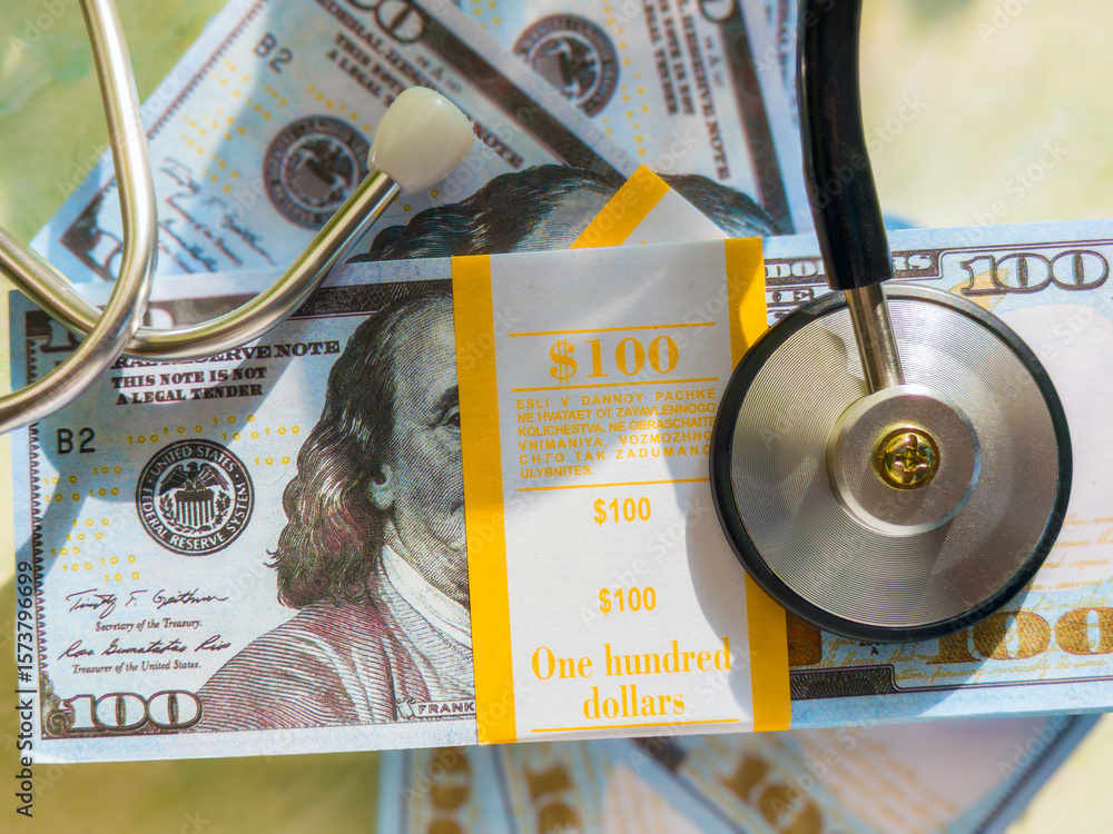 Poster the image features a stack of hundred-dollar bills alongside a stethoscope, symbolizing the intersec