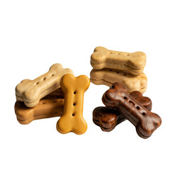 Pile of assorted bone shaped dog biscuits in different flavors isolated on transparent background