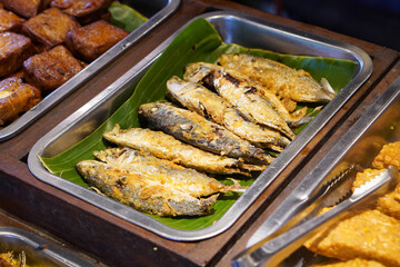 Traditional Indonesian Food, captured on July 10, 2025. Authentic dishes made with local spices, served with rice, meats, vegetables, and sambal for rich flavor.