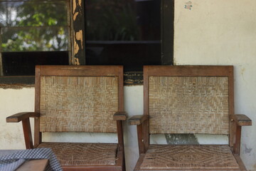 Wooden chair at grandma's house that has rattan wood weaving
