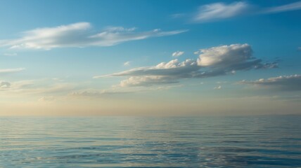 Calm ocean under a serene sky with scattered clouds featuring ocean, sky, clouds