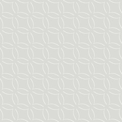 A seamless pattern features interlocking geometric shapes, creating a symmetrical design with subtle color contrasts. The repetitive motif evokes a sense of harmony and balance.