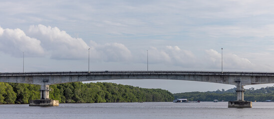 A panoramic view of a fishing village and mangrove forest along a river in Kuala Penyu, Sabah,...