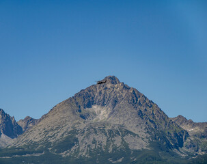 Gerlachovsky Peak (Gerlachovsky stit) with the helicopter flying over the top.
