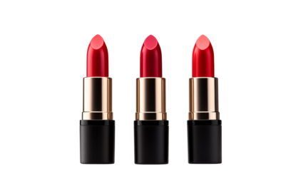 Three elegant tubes of red lipstick stand against a stark, solid black backdrop for cosmetics marketing.