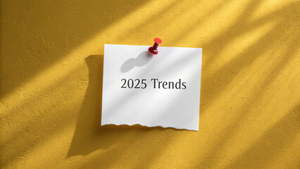 Minimalist note on yellow wall showcasing 2025 trends with shadow effect