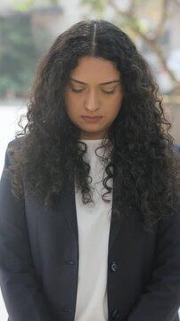 Vertical Video of Curly Hair Indian Businesswoman Feeling Guilty