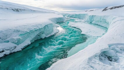 Turquoise river flows through a snowy arctic landscape with ice formations and mountains in the background under a cloudy sky