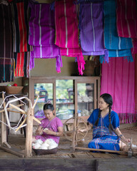 Beautiful Young Women Learning Traditional Karen Weaving in Chiang Mai, Thailand.