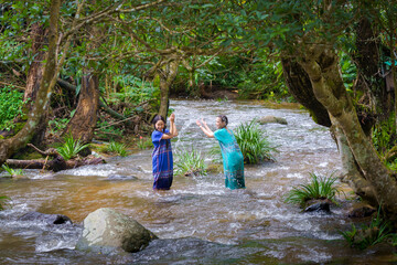 Asian Pretty Women Enjoy Playing in Stream, Doi Inthanon, Chiang Mai, Thailand.