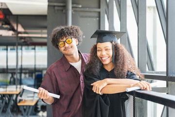 Happy Graduates Celebrate Success on Campus, Joyful Diverse Students on Graduation Day, Young Man...