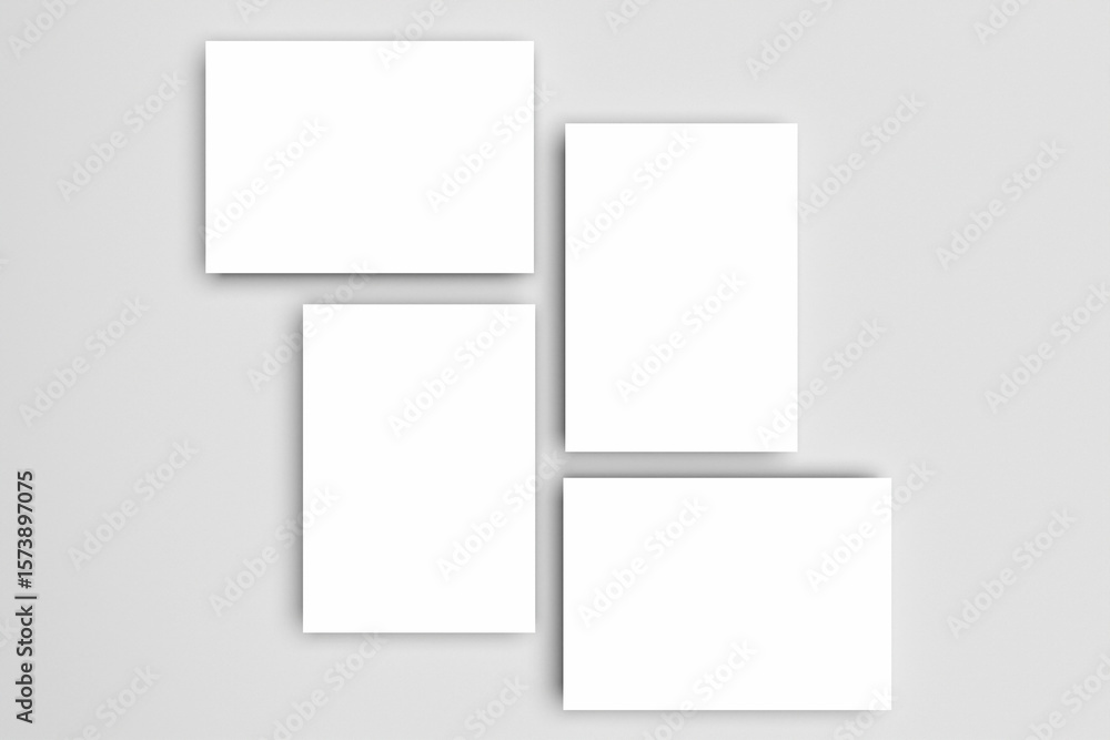 Poster four blank white a4, a5, or a3 paper mockups dynamically arranged and isolated on a gray background 