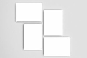 White A4 paper, magazine, or business card mockups floating diagonally with soft shadows isolated on grey background.
