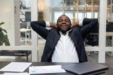 African american businessman feeling relaxed after a long busy working day