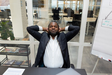 African american businessman feeling relaxed after a long busy working day