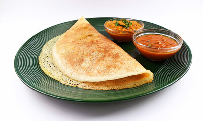 South Indian food set dosa with tomato chutney. Also called nice set dosa. Homemade Dosa, dhosa, masala, plain, maisuri (Ghee Roast) with Chutney. Common Indian breakfast.
