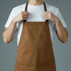 Person in White T-shirt Adjusting Brown Apron - Barista Chef Uniform