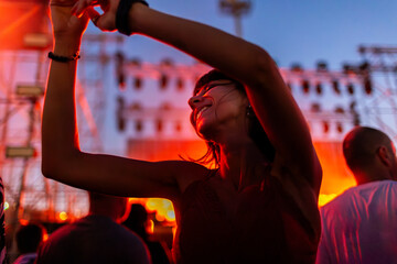 girl at party, dancing and smiling with happiness, celebration and excitement. Young woman dancing...