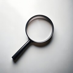 Minimalist close-up of a black-handled magnifying glass on a clean background, symbolizing investigation, analysis, and research