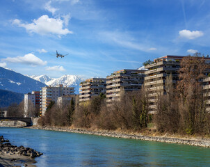 Plane flying over Innsbruck city