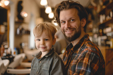 Caucasian father and son smiling in barbershop setting